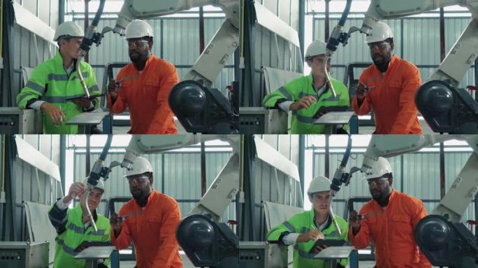 保护工作服的技术工程师小组控制和指导工厂中工业机器人的机械臂的维护