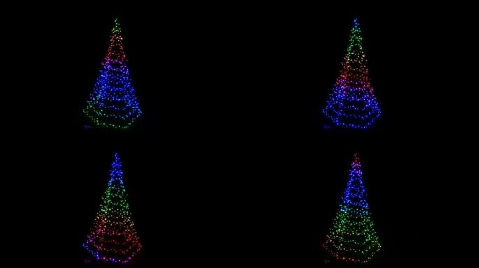 黑色背景上照明多彩的现代圣诞树
