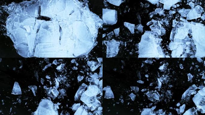 黑色背景上分离的落冰板块的超慢动作。