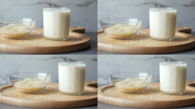 桌上的一杯牛奶和米饭，非奶类牛奶概念