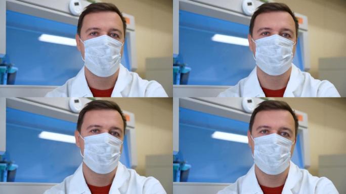 戴着医用口罩的男性化学实验室研究员说不，并在生物医学实验室摇了摇头。科学家坐在老式实验室里，意见分歧