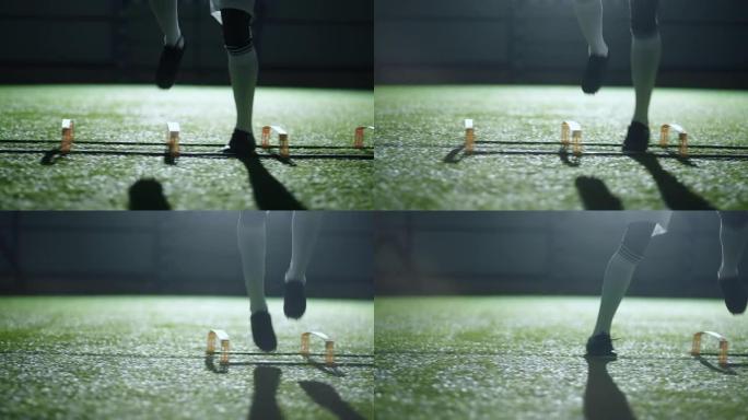 足球俱乐部训练男子的腿，运动场特写镜头，非洲职业足球运动员