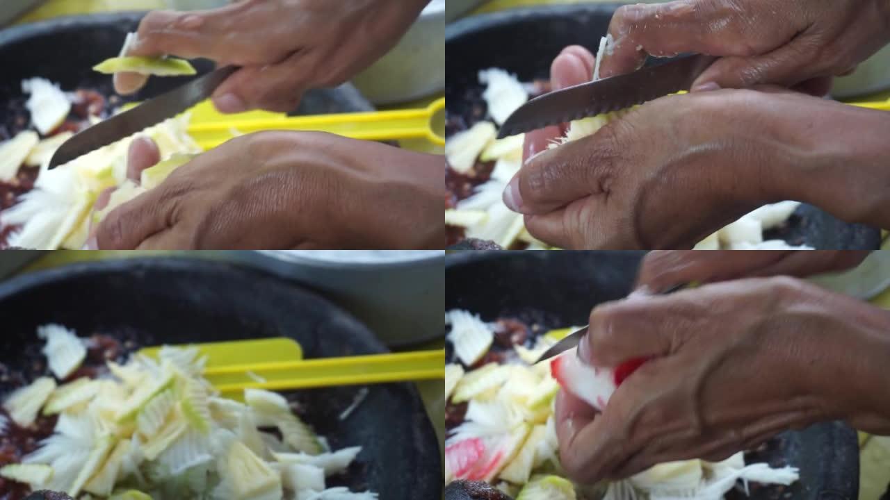 印尼食品Rujak贸易商正在切水果