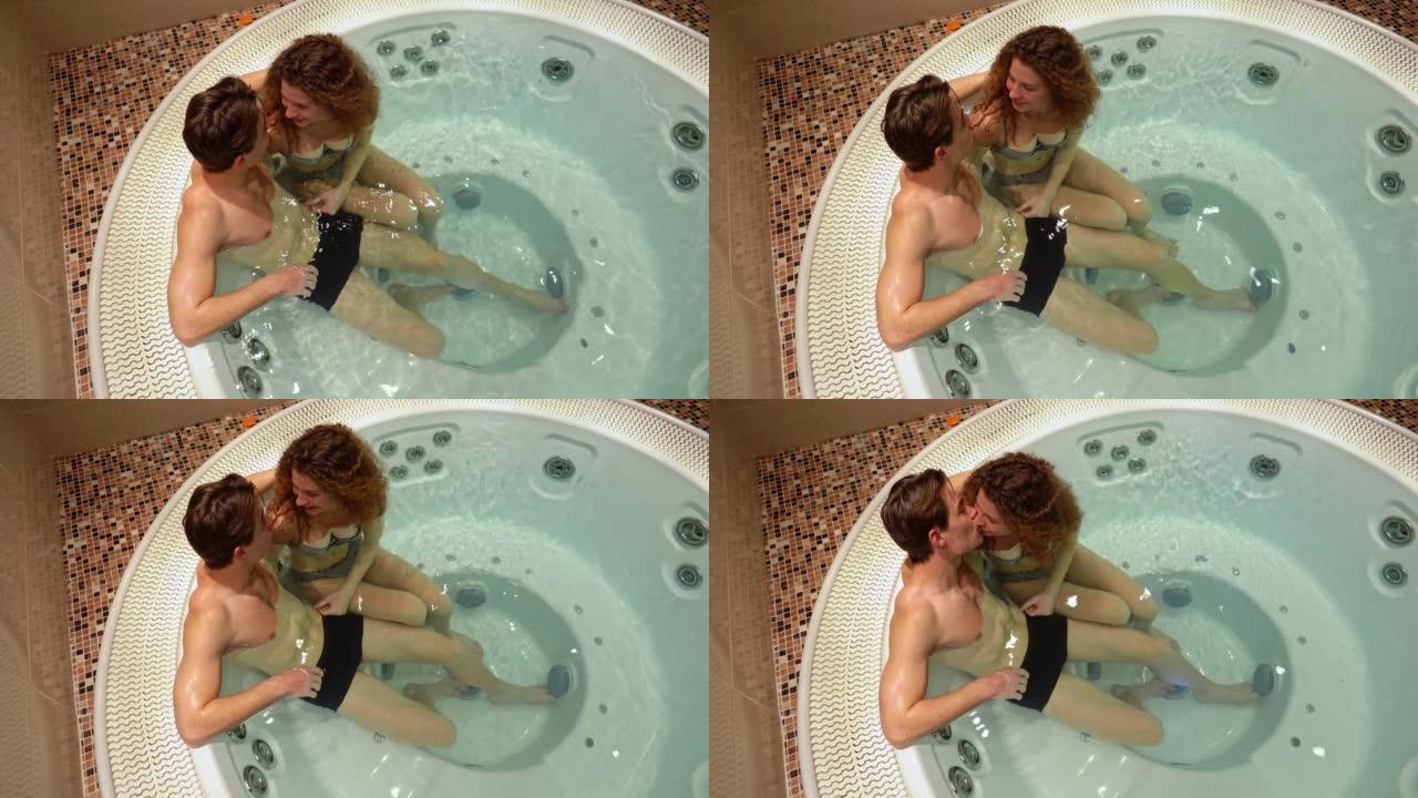 热水浴缸里的年轻夫妇