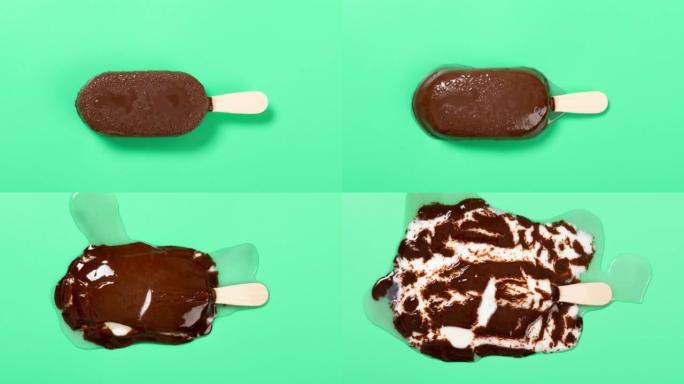 巧克力外层配牛奶和蓝莓口味冰棒融化时光倒流在绿色背景上的顶角视图
