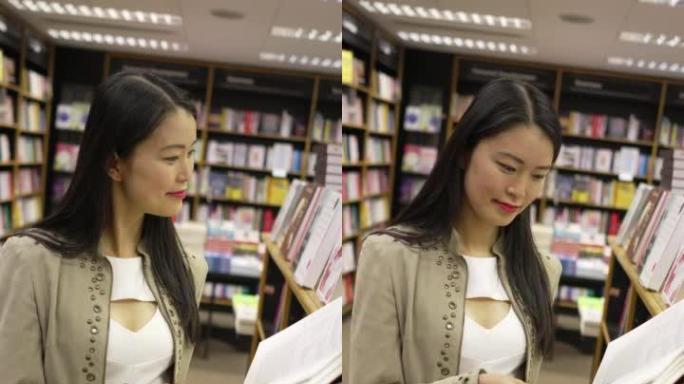 一名年轻女子在书店里浏览一本书