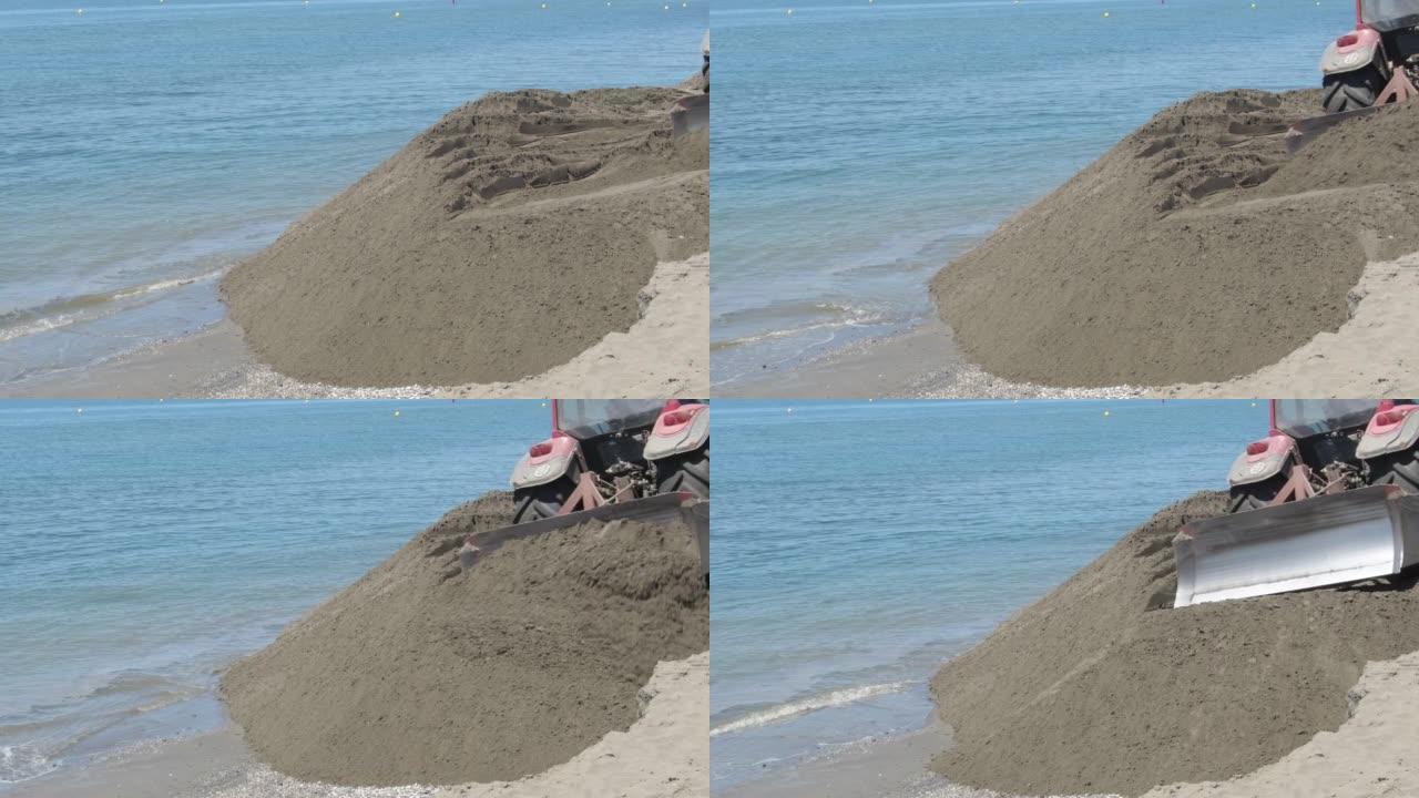 拖拉机在海滩再生中移动沙子