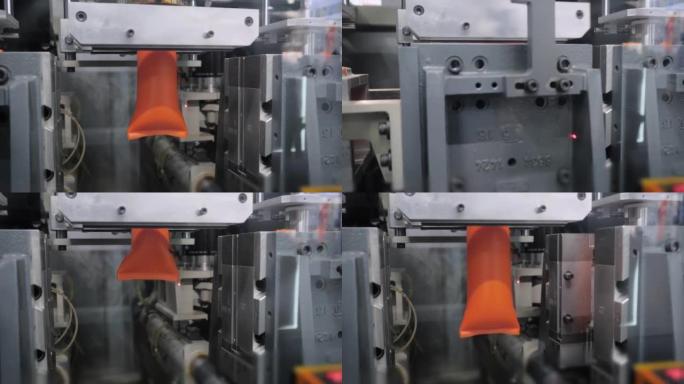 自动吹塑机: 制造空橙色塑料