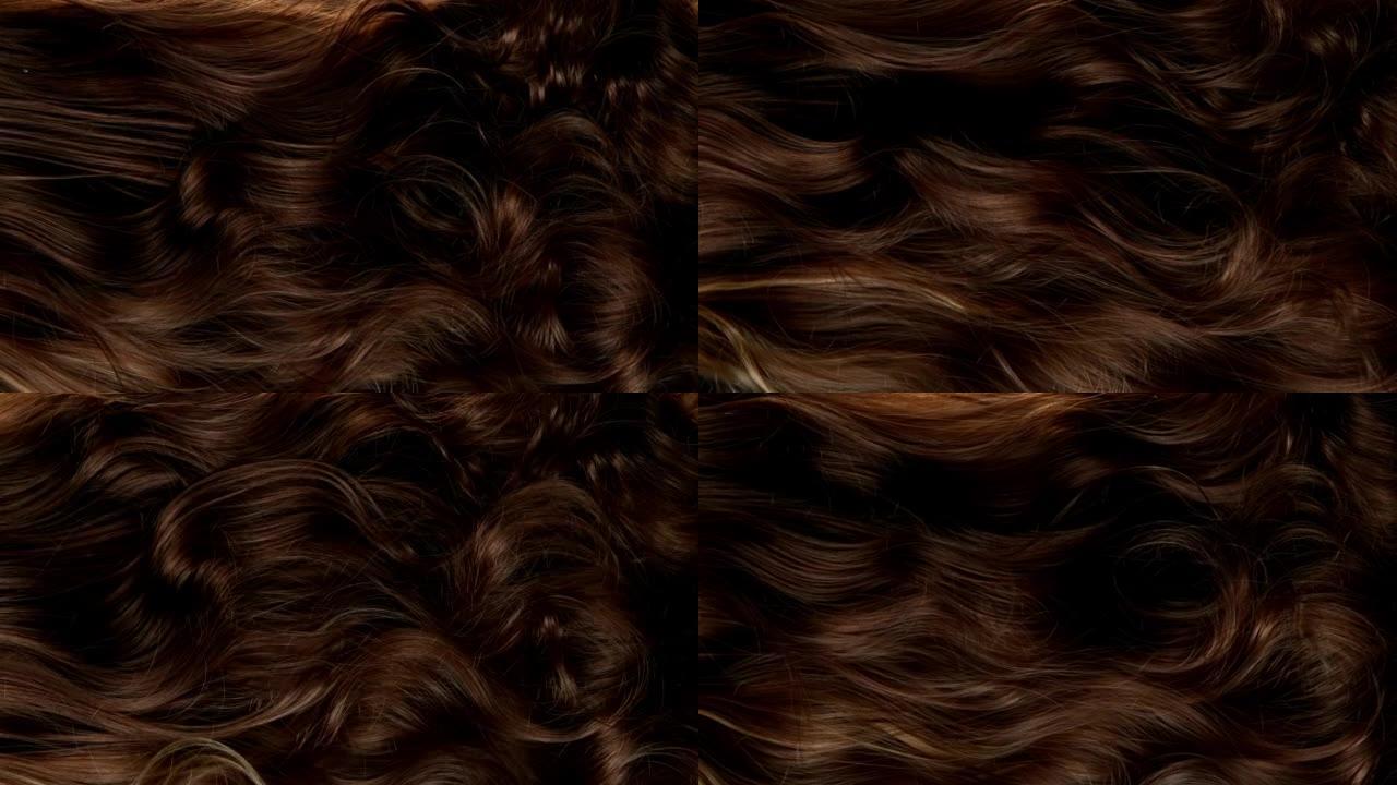 波浪棕色头发的超慢动作细节。