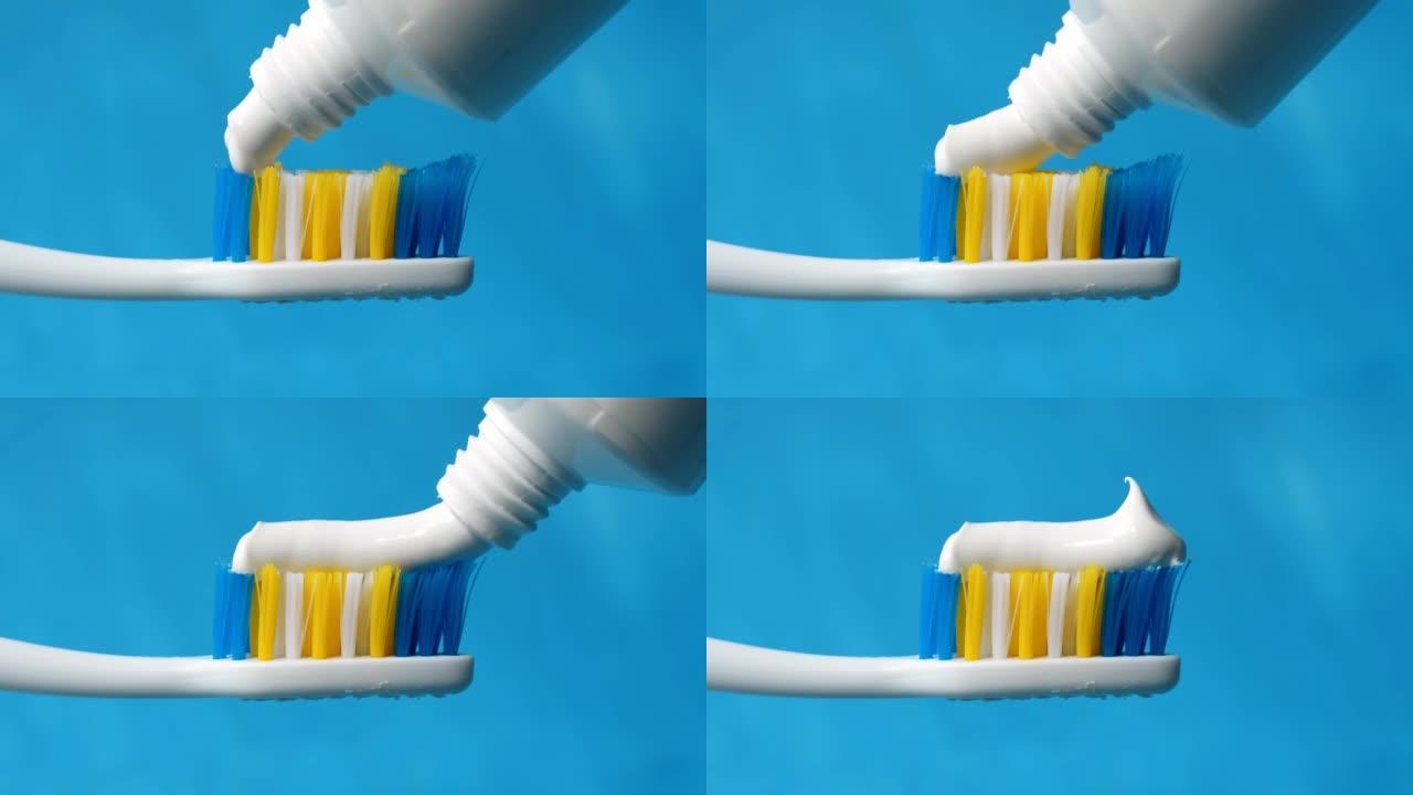 白色牙膏，末端有一个美丽的卷曲从牙刷的管子上挤出，特写在蓝色背景上。4k原始宏视频。