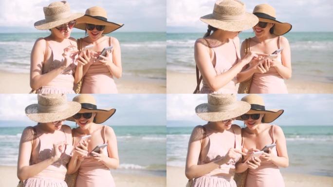快乐的女人在海滩上的智能手机上分享美好的记忆图片