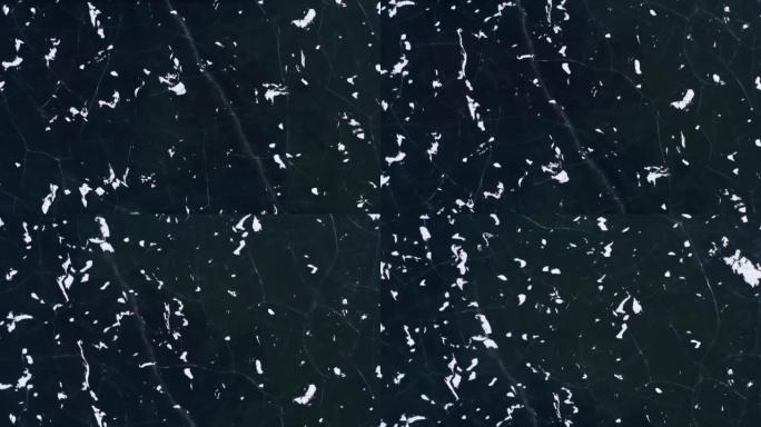无人机拍摄了冰冻湖的破裂冰