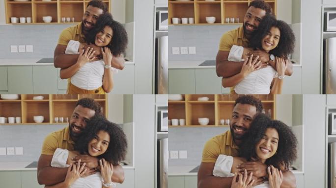 一对幸福相爱的黑人夫妇的肖像，他们互相抱着，在家里的室内享受一天。充满爱心的夫妻在一起度过了美好的时