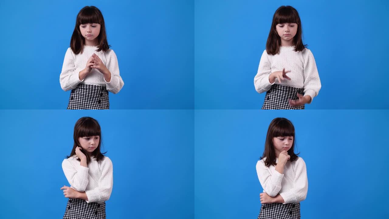 4k视频，一个年轻女孩摸着头发，想着蓝色背景上的负面表情。