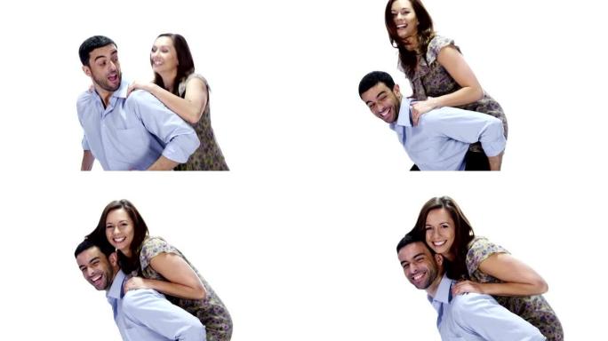 一对年轻的夫妇在白色的背景上玩得很开心