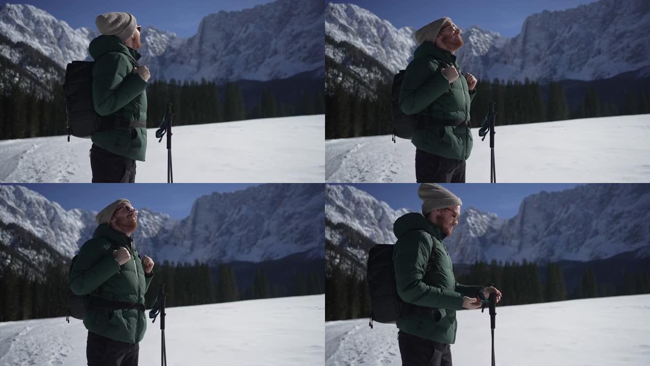 一名男子准备在冬季徒步旅行的特写镜头