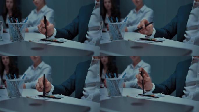 商务会议期间商人手中的旋转笔，特写视图，4K，Prores
