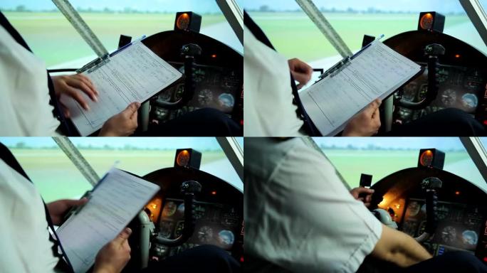 轻型飞机飞行员准备起飞，在文件中检查飞行路线