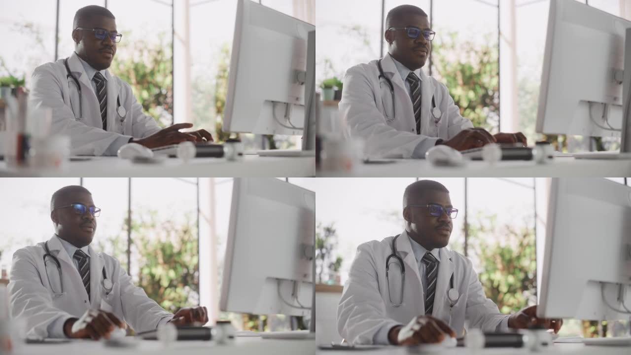 一位黑人医疗保健专业人员的肖像，专注于在医院办公室的台式计算机上工作。白大褂诊所医生在线指定处方，更