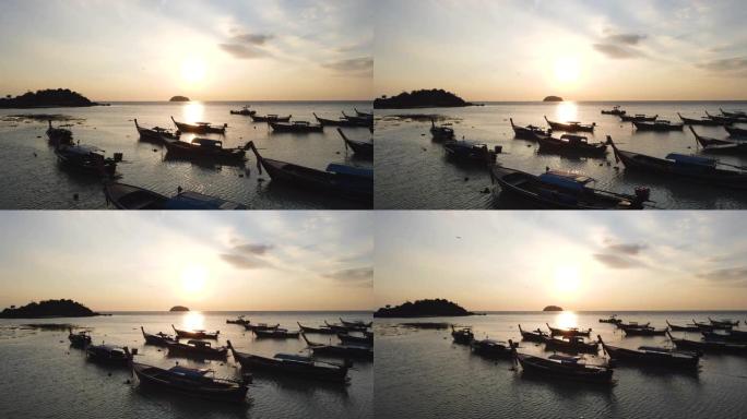 泰国沙顿Koh Lipe日出时的海洋和剪影渔船鸟瞰图