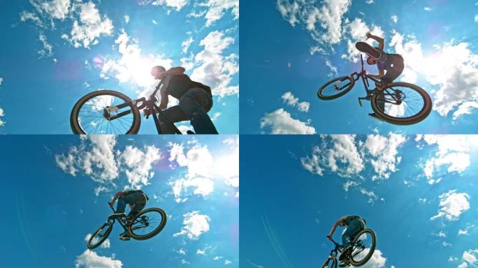 SLO MO男骑自行车的人在DJ自行车上空降时做了一个无手无脚的把戏