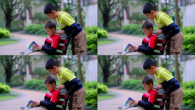两个小朋友在公园长椅看漫画书