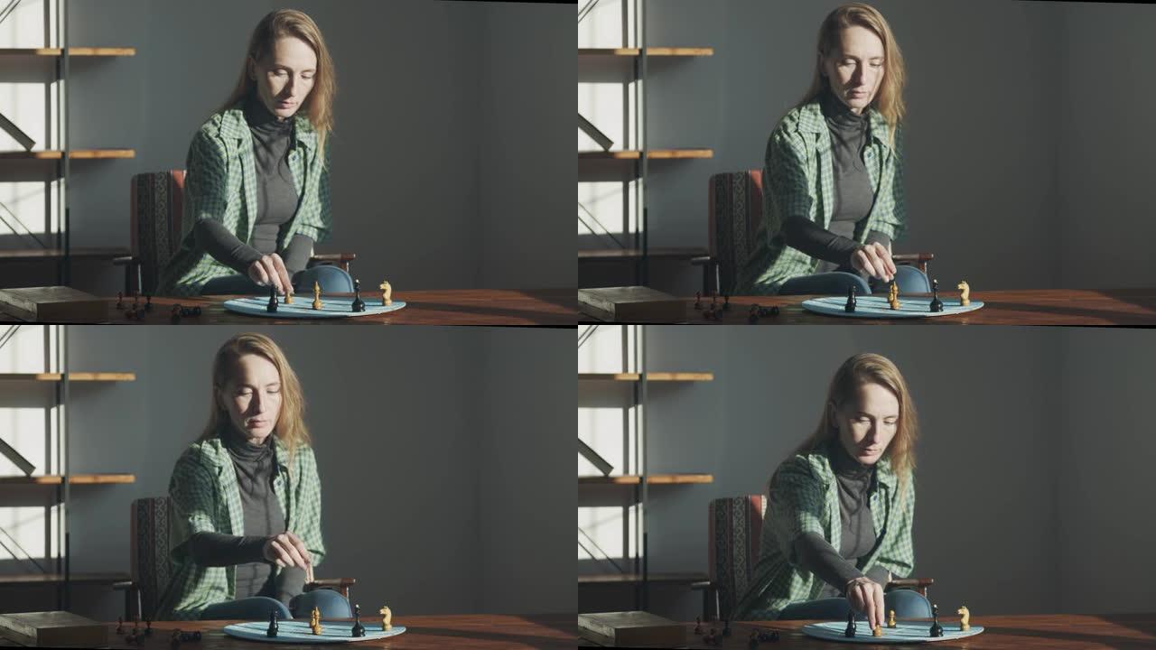 一个女人用图案在蓝色的圆形板上重新排列棋子。心理测验与人物类比