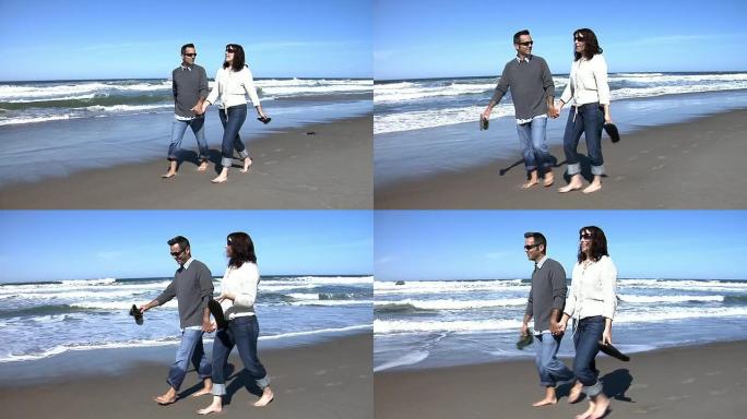 夫妇在海滩上散步