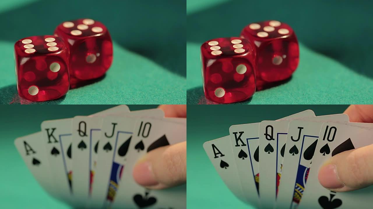 成功的扑克玩家的手向镜头显示黑桃皇家同花顺，