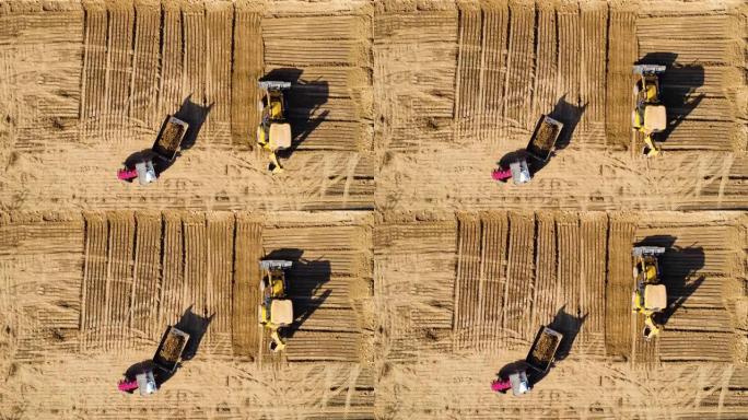 建筑工业机械挖掘机拖拉机沙坑空中无人机视图拍摄顶角