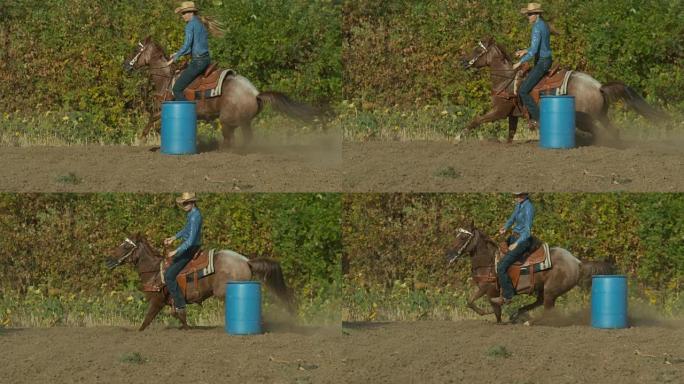 骑着马的女人以超慢动作绕过桶
