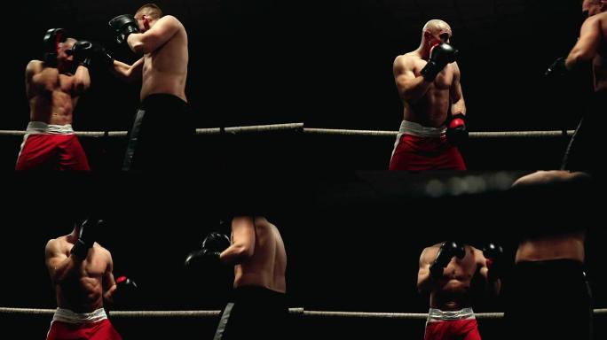 两名职业拳击手举行了比赛的最后一轮，房间在环的绳索后面移动