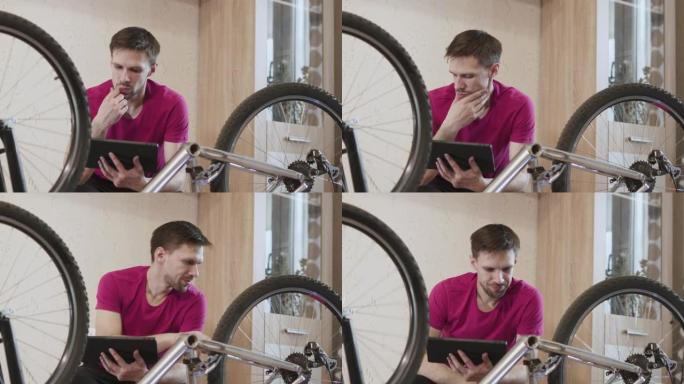 高加索人对互联网上的平板电脑《自行车维修手册》感到困惑。