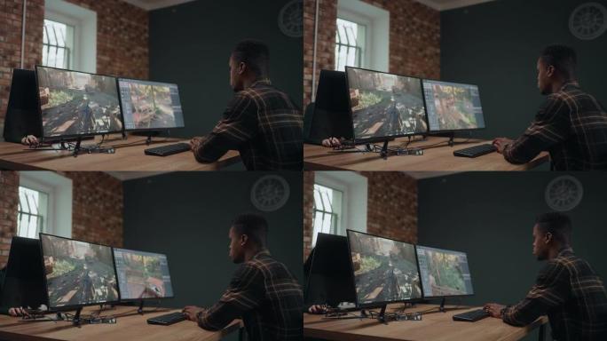 计算机游戏开发人员为游戏创建新界面，非裔美国人在办公室工作