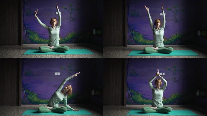 一个坐着的女人在紫色的墙壁上练习瑜伽的镜头