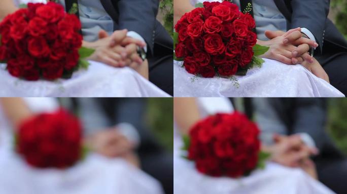 新婚夫妇新娘和新郎在长椅上捧着一束玫瑰花