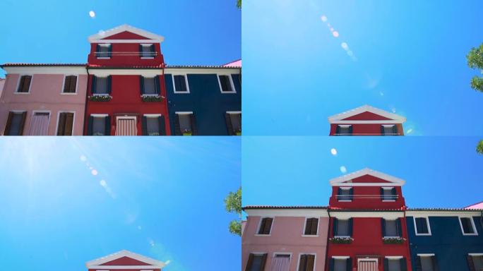 布拉诺岛奇妙的粉色、红色和蓝色房屋装饰着漂亮的花朵