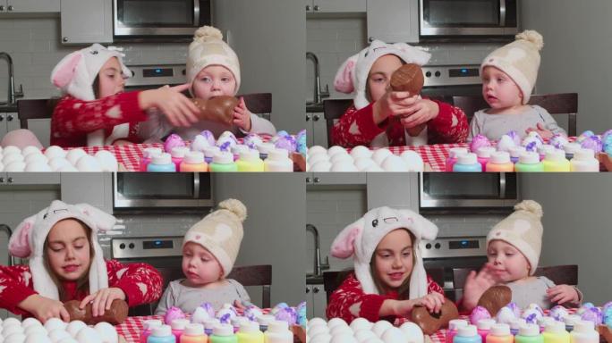 孩子们在复活节吃巧克力兔子。