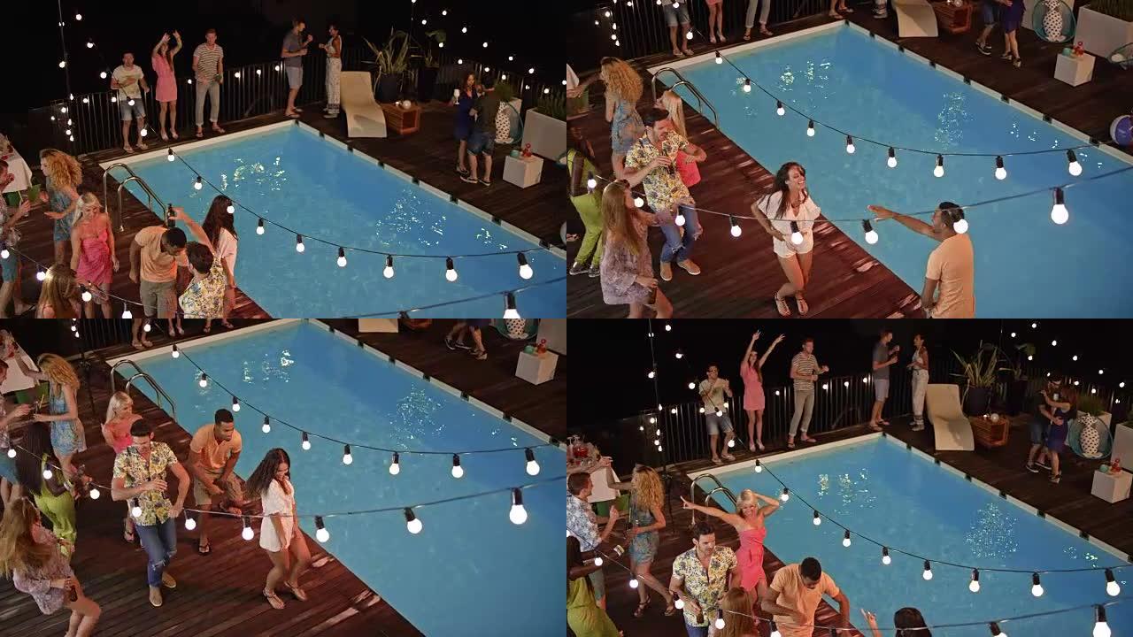 晚上，CS人在游泳池边的聚会上跳舞和聊天
