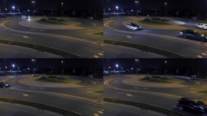 夜间在环形交叉路口行驶的LD汽车