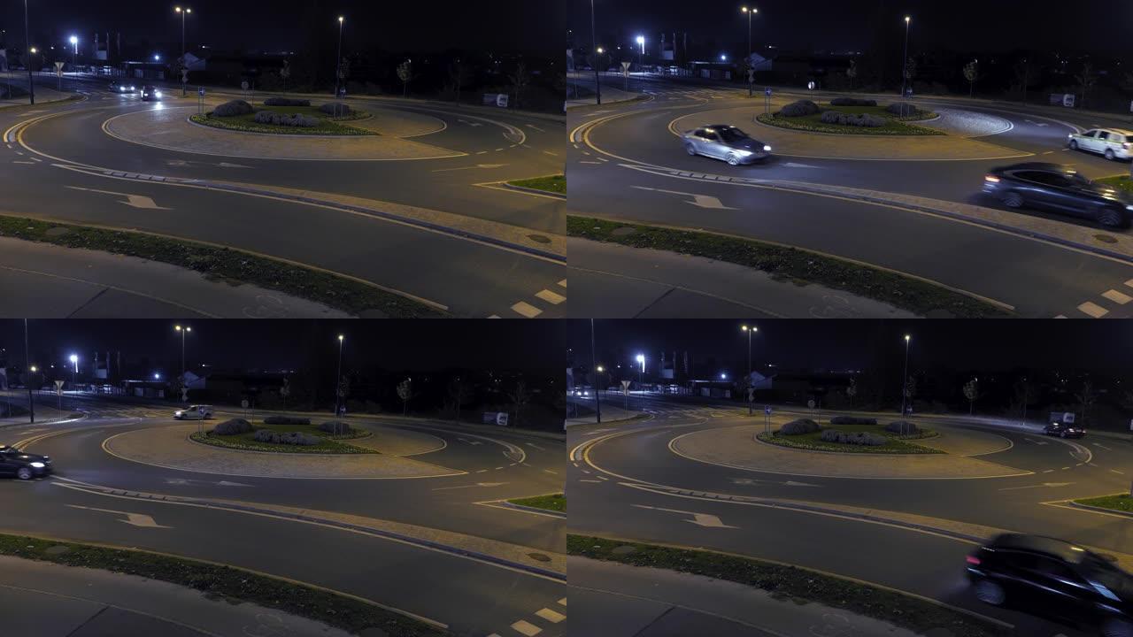 夜间在环形交叉路口行驶的LD汽车