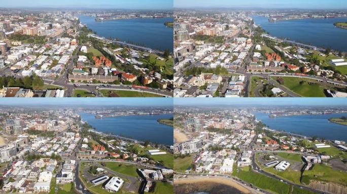 在阳光明媚的日子里，空中无人机回撤了新南威尔士州纽卡斯尔的港口城市