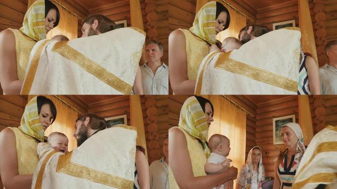 洗礼仪式后，牧师穿着婴儿脖子上的十字架