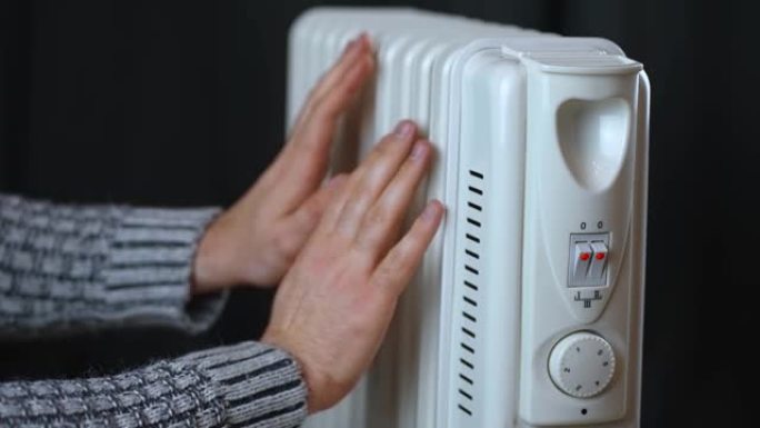无法识别的人用电加热散热器暖手