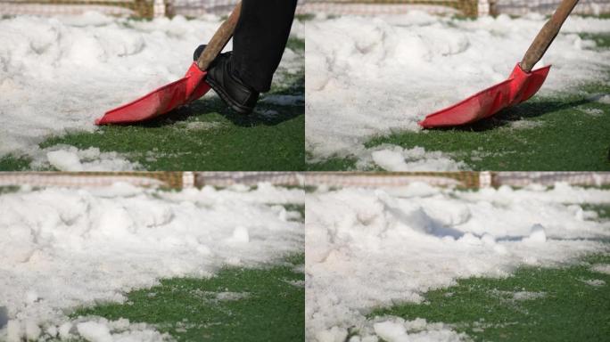男人使用红色模糊的雪铲。