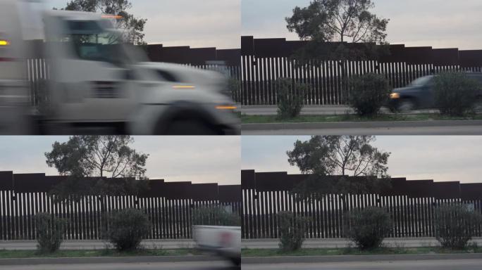 墨西哥的国际边界隔离墙从蒂华纳 (Tijuana) 在繁忙的高速公路上向美国望去