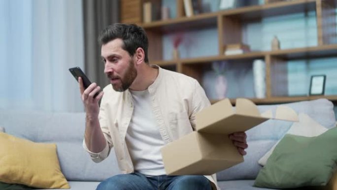 不满意的客户在家里对着智能手机大吼大叫，因为交货或产品订单的质量问题