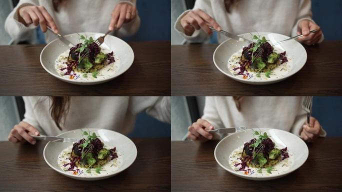 一个女人在吃高档蔬菜烩饭的特写镜头
