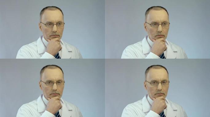男性治疗师或科学家认真思考复杂问题的严肃面孔