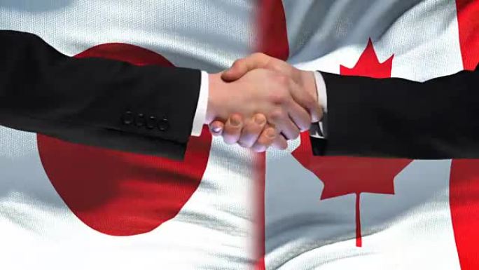 日本与加拿大握手，国际友好关系，旗帜背景